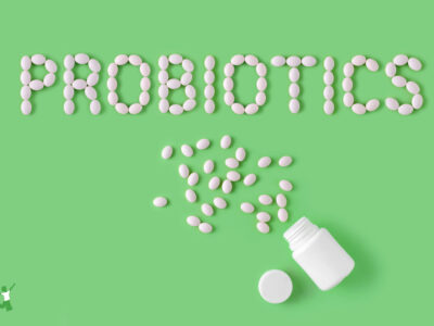 beneficial probiotics on green background