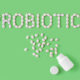 beneficial probiotics on green background