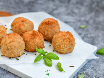 homemade hush puppies fried in healthy fat on white plate