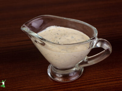 cultured tartar sauce in glass dish on wood table