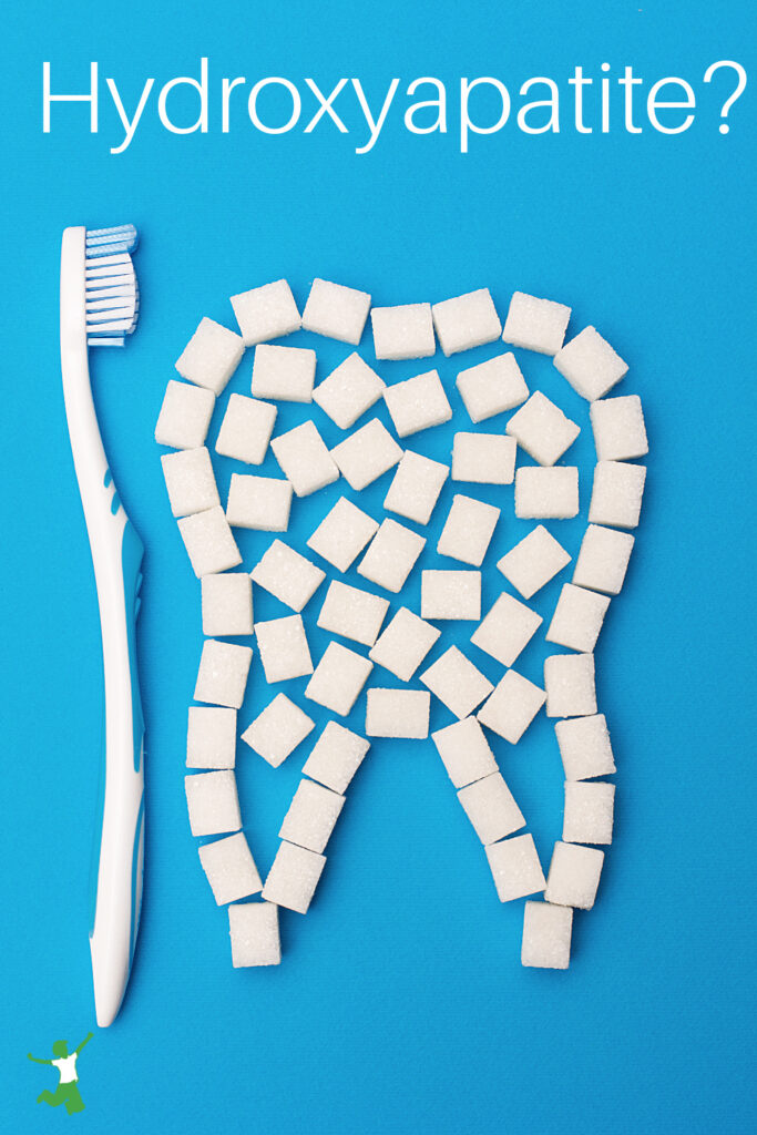 hydroxyapatite with tooth brush on blue background