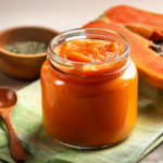 probiotic papaya butter in glass jar with wooden spoon