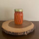 fermented carrot sticks in mason jar on wooden table