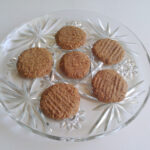 half dozen grain-free ginger snaps on decorative glass plate