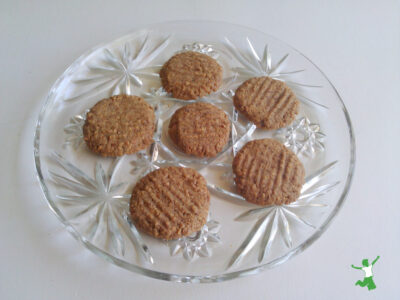 half dozen grain-free ginger snaps on decorative glass plate