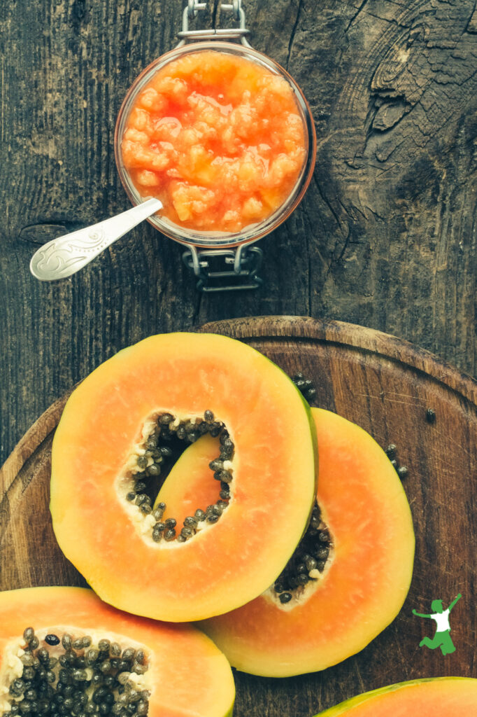 freshly fermented papaya butter in mason jar wooden background