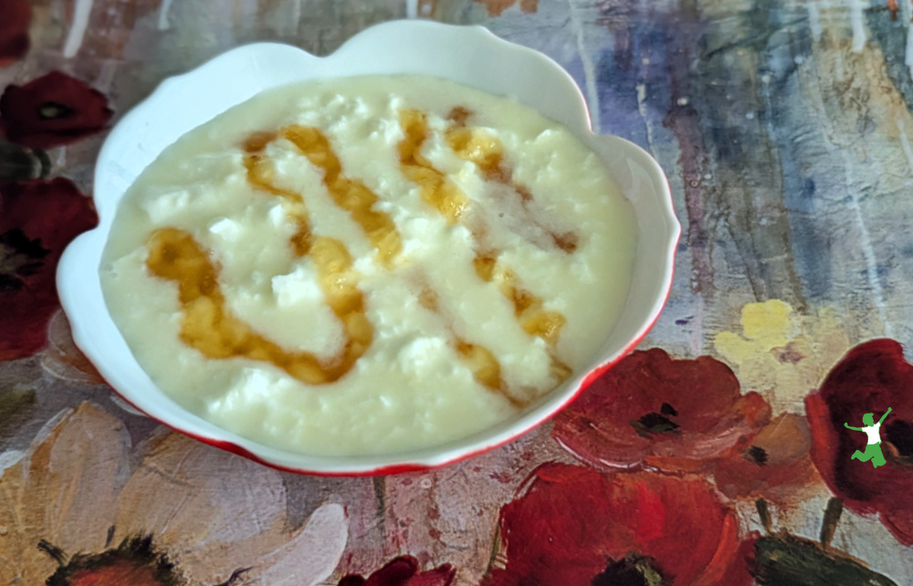 raw L. reuteri yogurt with a drizzle of honey in red dish