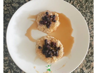 soaked oatmeal pancakes topped with blueberries on white plate