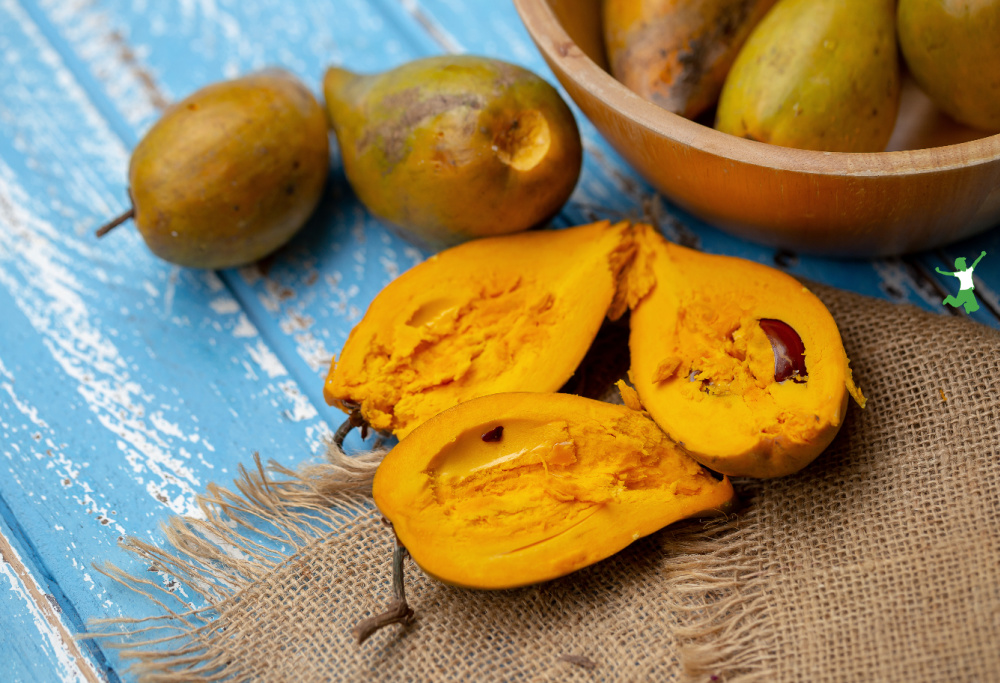 ripe lucuma sweetener superfood fruits in wooden bowl