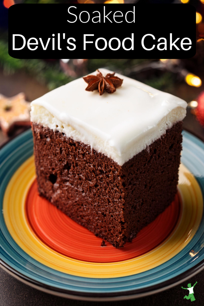 soaked devil's food cake with white frosting on colorful plate