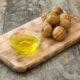 walnut oil in small glass dish on cutting board