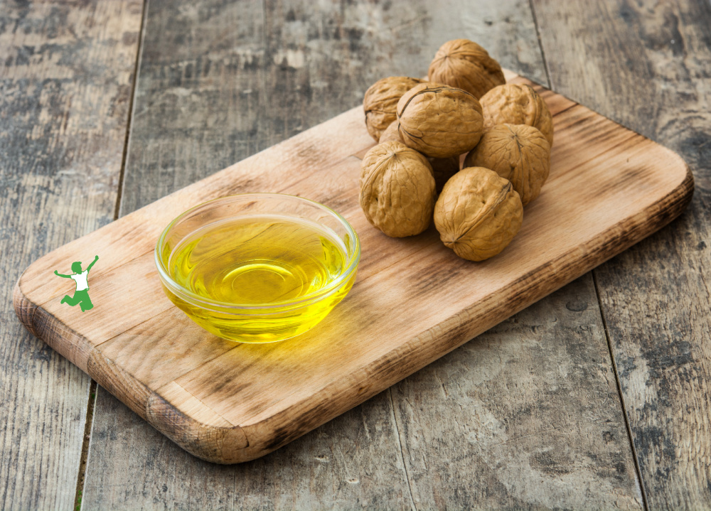 walnut oil in small glass dish on cutting board