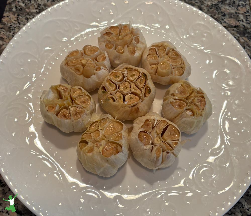 roasted garlic heads on a platter