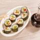 healthy soy sauce substitute in glass bottle with sushi