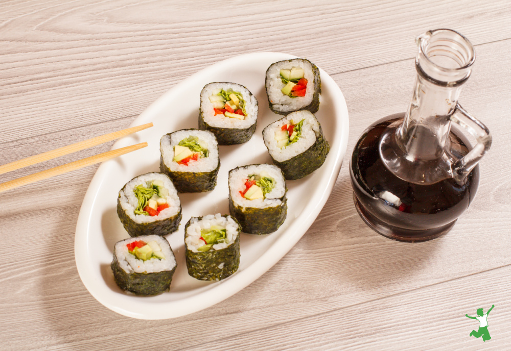 healthy soy sauce substitute in glass bottle with sushi