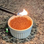 coconut creme brulee ramekin on granite counter