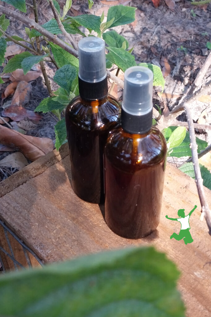 homemade beautyberry bug repellent in glass spray bottles