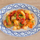 healthy sweet & sour sauce with chicken and vegetables on dinner plate