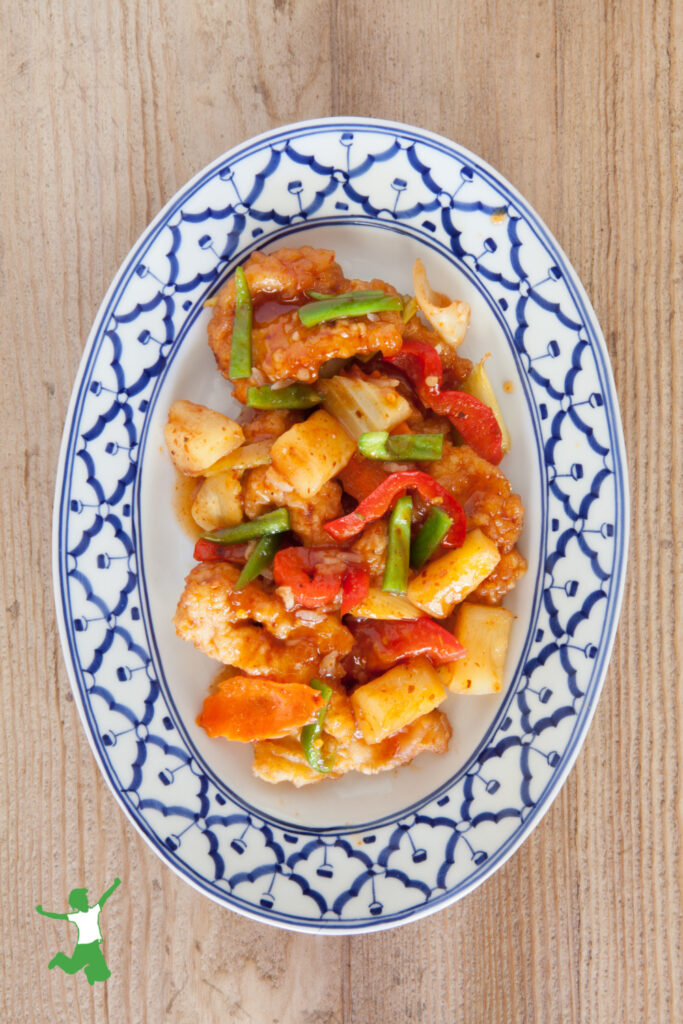 easy sweet and sour sauce served on chicken with vegetables